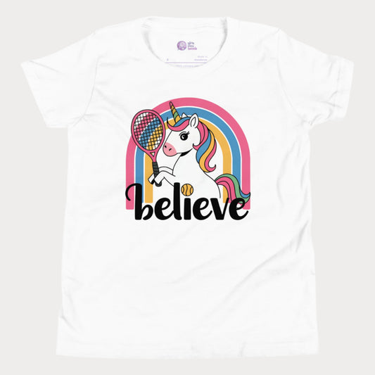 Kids tennis t-shirt featuring a unicorn holding a tennis racket against a rainbow with slogan "believe"