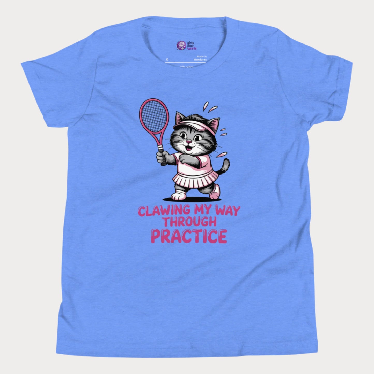 A sky blue girls’ tennis t-shirt featuring a determined gray kitten in a pink tennis outfit holding a pink tennis racket. The kitten is sweating and focused, with the phrase “Clawing My Way Through Practice” in bold pink lettering underneath.