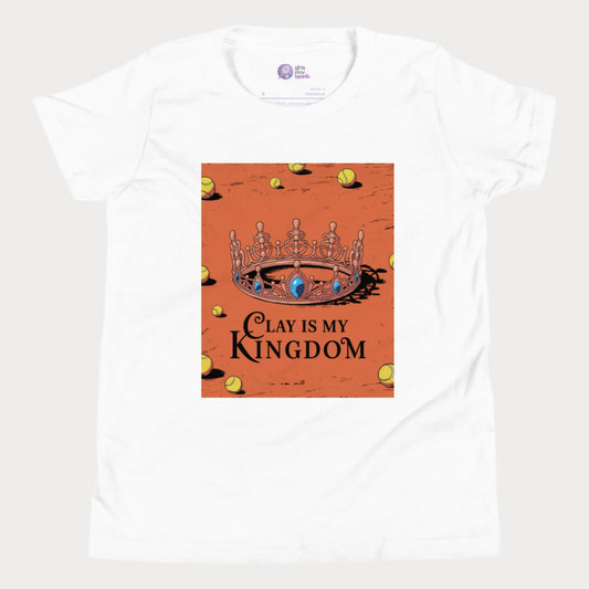 White tennis T-shirt featuring a regal crown on a clay court with scattered tennis balls and the phrase "Clay Is My Kingdom" in bold lettering.