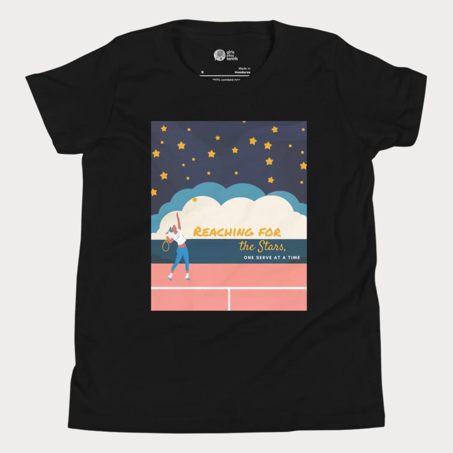 Black girls' tennis T-shirt featuring a motivational design of a young girl serving on a tennis court under a starry sky, with the phrase "Reaching for the Stars, One Serve at a Time." Perfect for young tennis players who dream big.