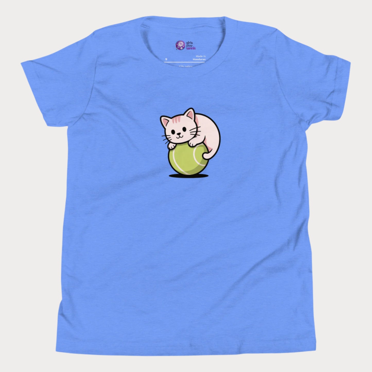 Heather blue girls’ tennis t-shirt featuring a cute kitten playfully curled around a bright green tennis ball in the center of the chest - a fun and whimsical design perfect for young tennis players who love animals and the game.