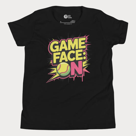 Black kids tennis t-shirt with bold comic-style "Game Face: ON" graphic and tennis ball illustration.