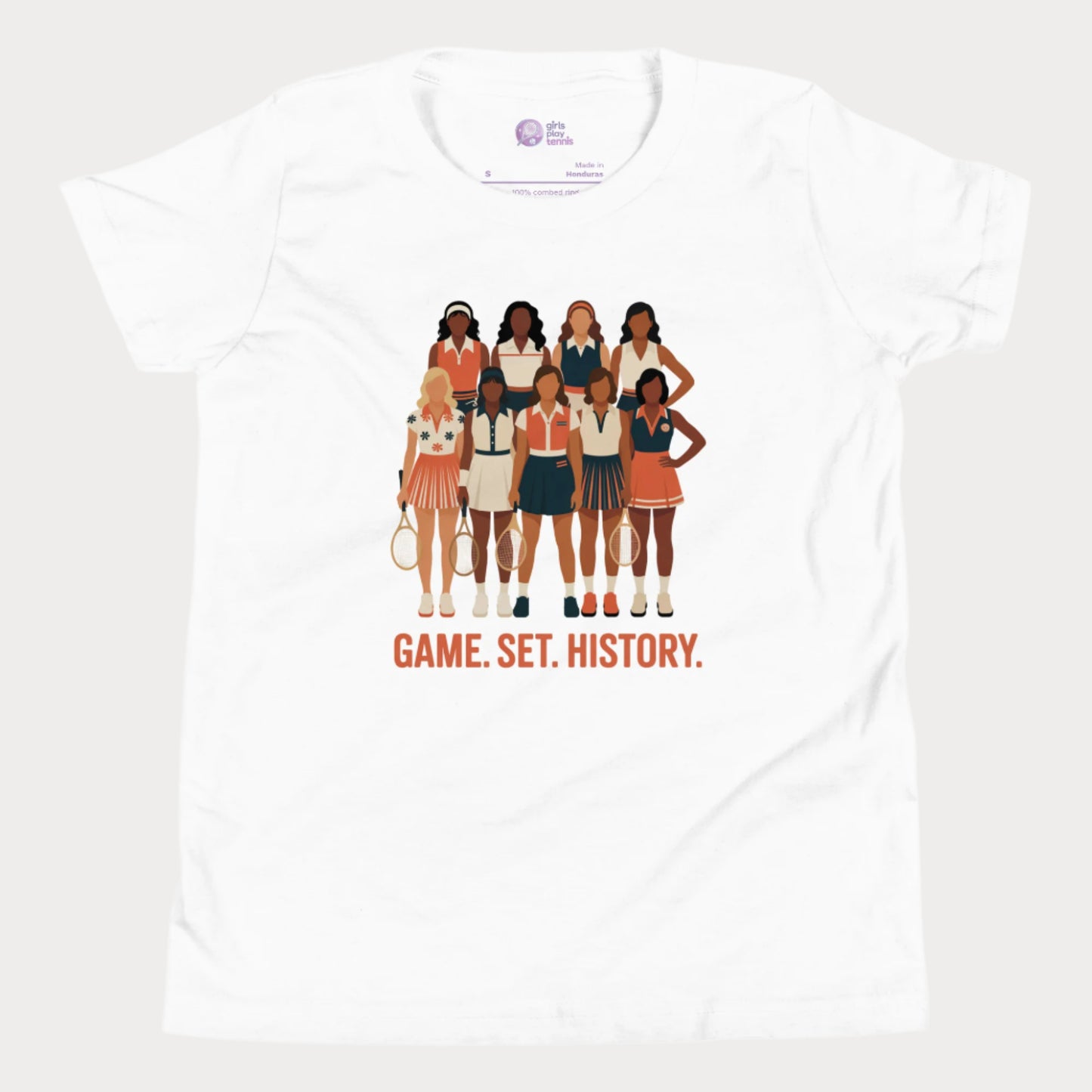 White kids tennis t-shirt with illustration of 9 vintage-style female tennis players and the phrase “Game. Set. History.” honoring women’s tennis pioneers.