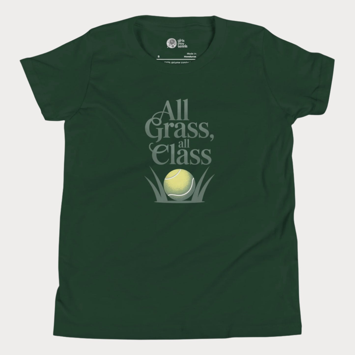 Green girls’ tennis T-shirt with green text “All Grass, All Class” and tennis ball in grass graphic.