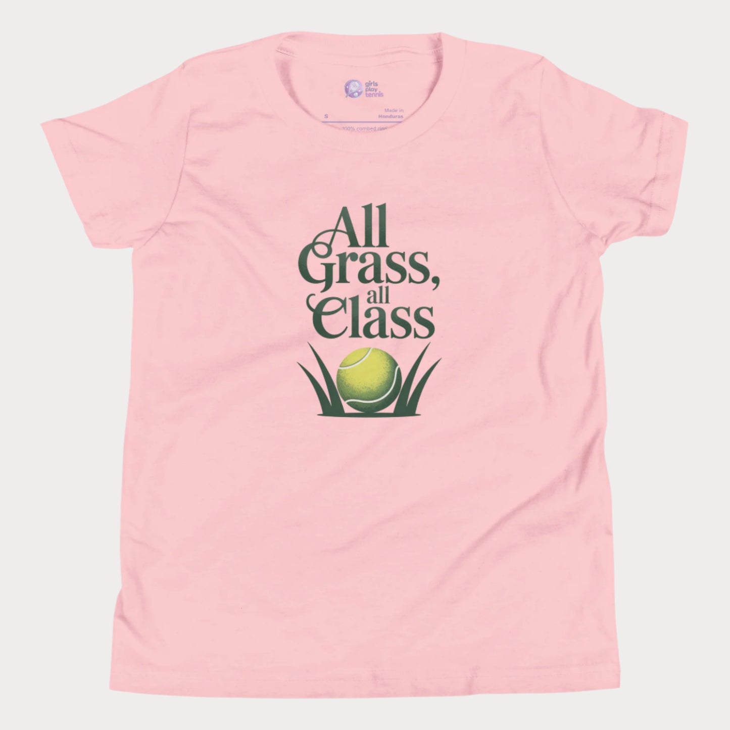 Pink girls’ tennis T-shirt with green text “All Grass, All Class” and tennis ball in grass graphic.