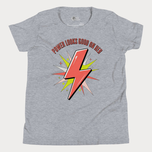 Girls tennis t-shirt with lightning bolt graphic and slogan “Power Looks Good On Her”