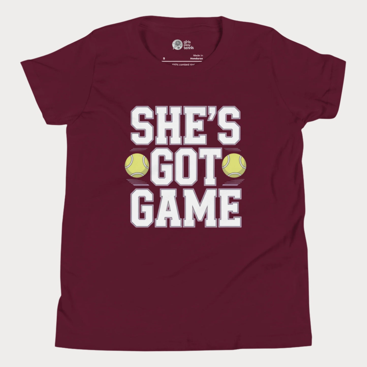 Youth tennis t-shirt with empowering slogan “She’s Got Game” and tennis ball accents