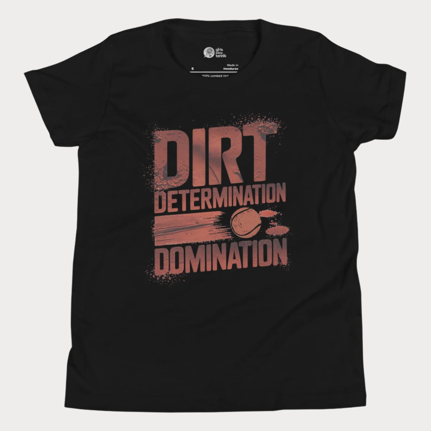 Black tennis T-shirt featuring bold typography reading "Dirt, Determination, Domination" in clay-red tones, with a graphic of a tennis ball streaking across the design.