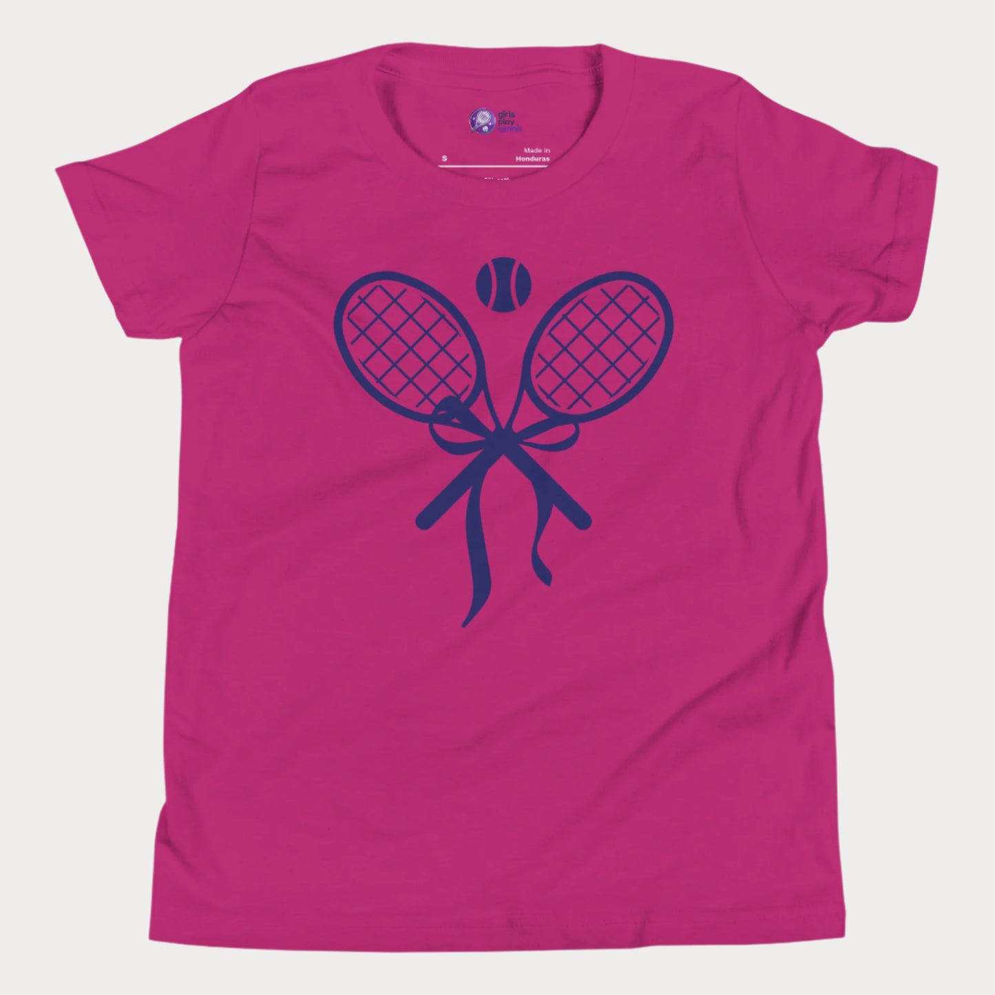 Cute girls' tennis t-shirt in berry featuring a stylish design of two crossed tennis rackets tied with a bow and a tennis ball above.