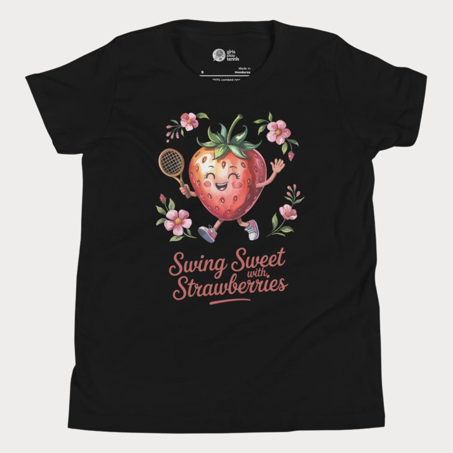 Black girls tennis t-shirt with a smiling strawberry holding a tennis racket surrounded by pink flowers and the phrase ‘Swing Sweet with Strawberries’