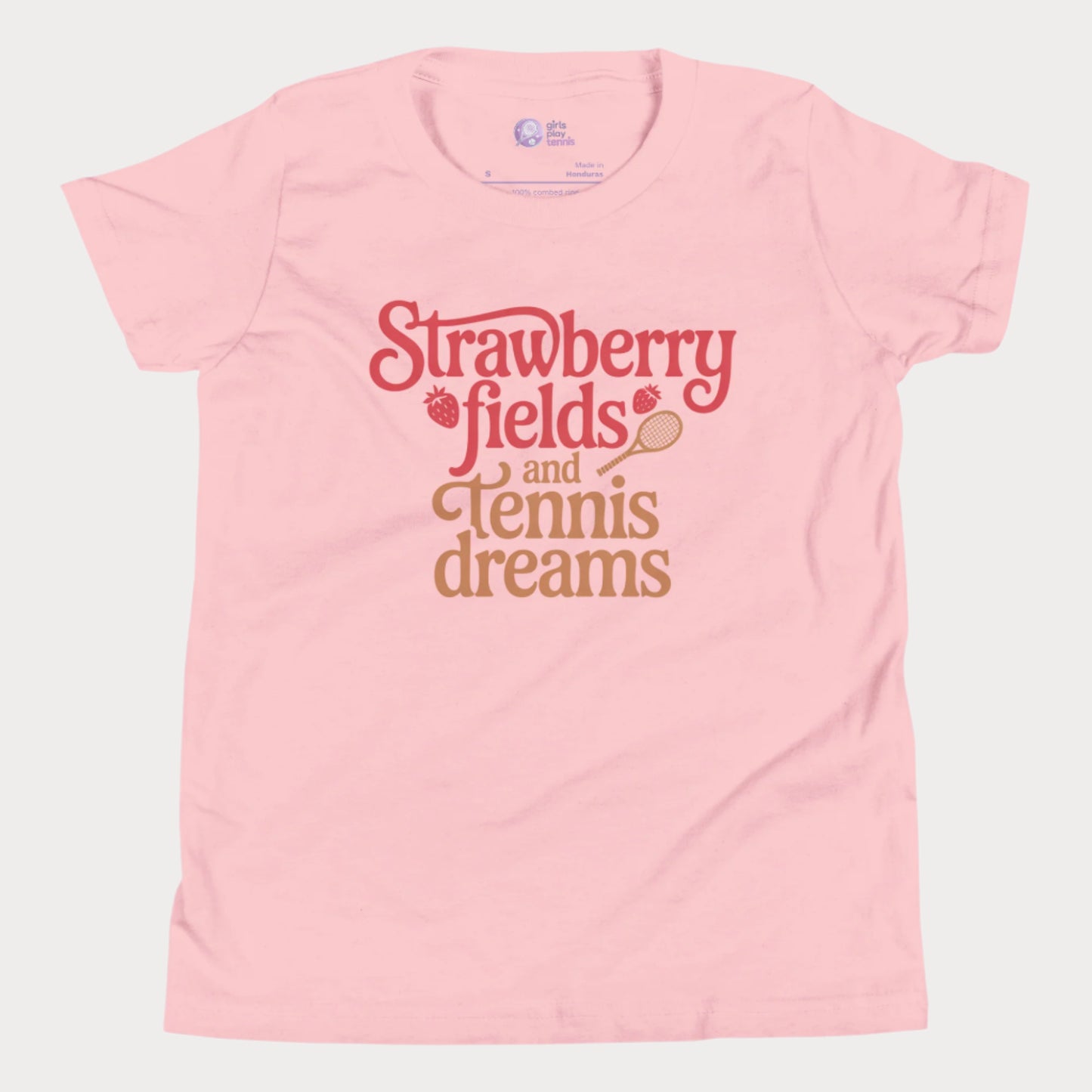 Pink girls tennis t-shirt with retro text that reads ‘Strawberry fields and tennis dreams’ with tennis and strawberry icons.