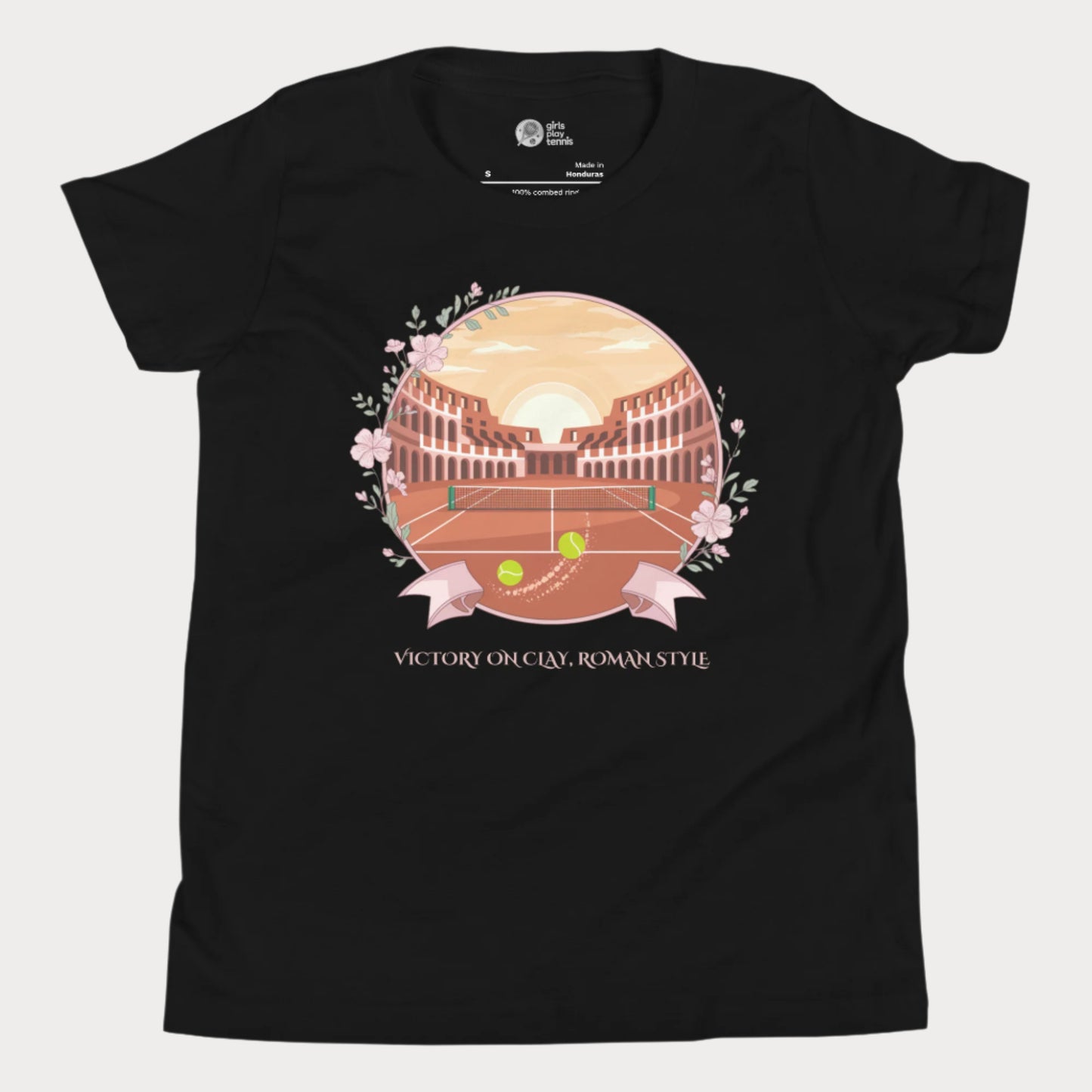 Black girls' tennis T-shirt featuring a clay court set inside an ancient Roman amphitheater, surrounded by floral accents and a banner reading "Victory on Clay, Roman Style."