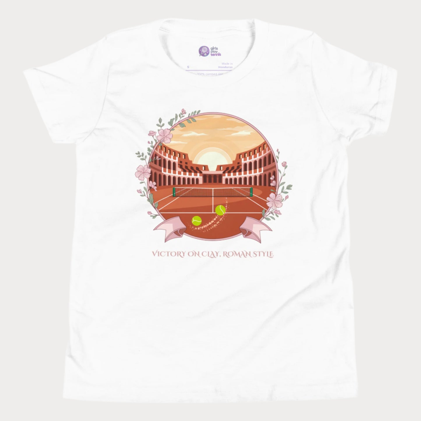 White girls' tennis T-shirt featuring a clay court set inside an ancient Roman amphitheater, surrounded by floral accents and a banner reading "Victory on Clay, Roman Style."
