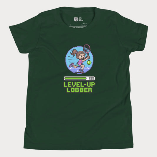 Girls Play Tennis Level Up Lobber t-shirt with XP badge, progress bar, and tennis girl graphic for US hard court season