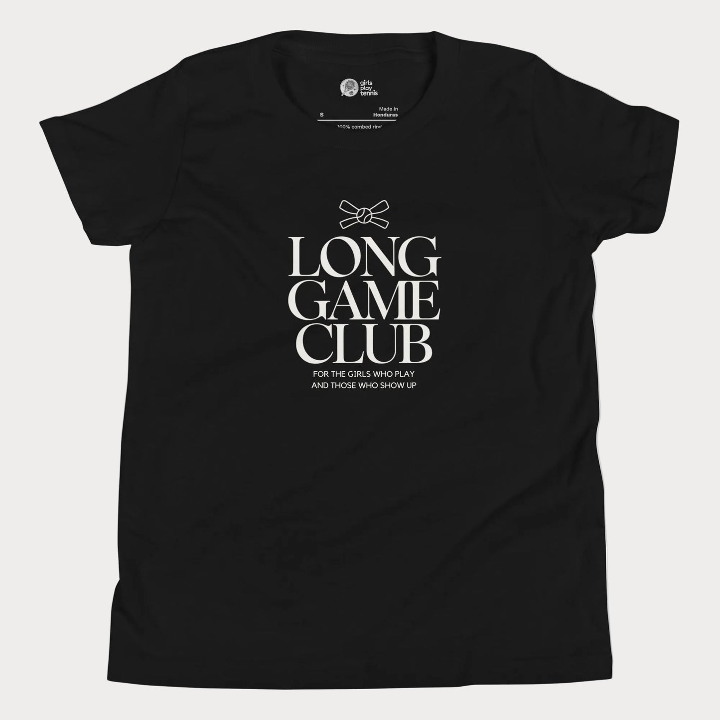 Long Game Club tennis tee in black with white typography and bow detail for girls and women