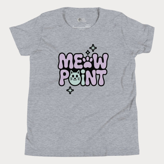 A heather grey girls’ tennis t-shirt with bold, bubble-style lettering that spells out “Meow Point” in pastel purple and black. The design includes a playful pink paw print for the letter "O" and a smiling cat face as the letter "I", surrounded by sparkly stars.