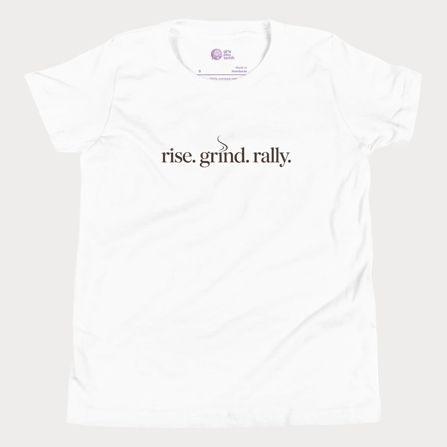White tennis t-shirt with Rise Grind Rally slogan across the chest – Girls Play Tennis apparel.