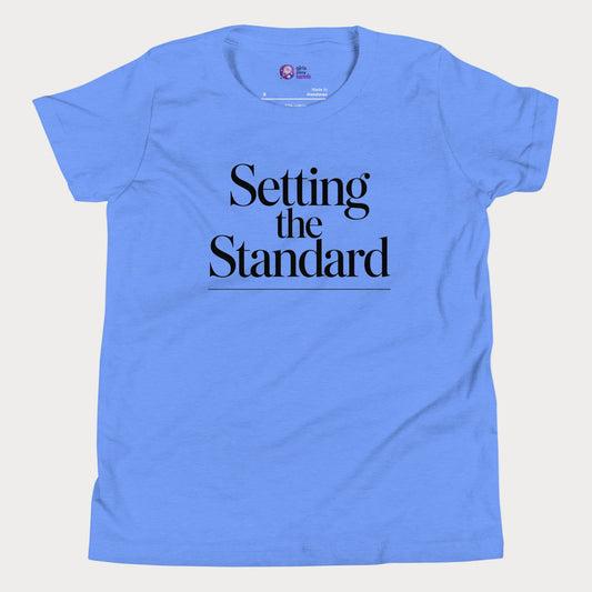 Setting the Standard tennis tee in blue with minimalist white typography design for women and girls