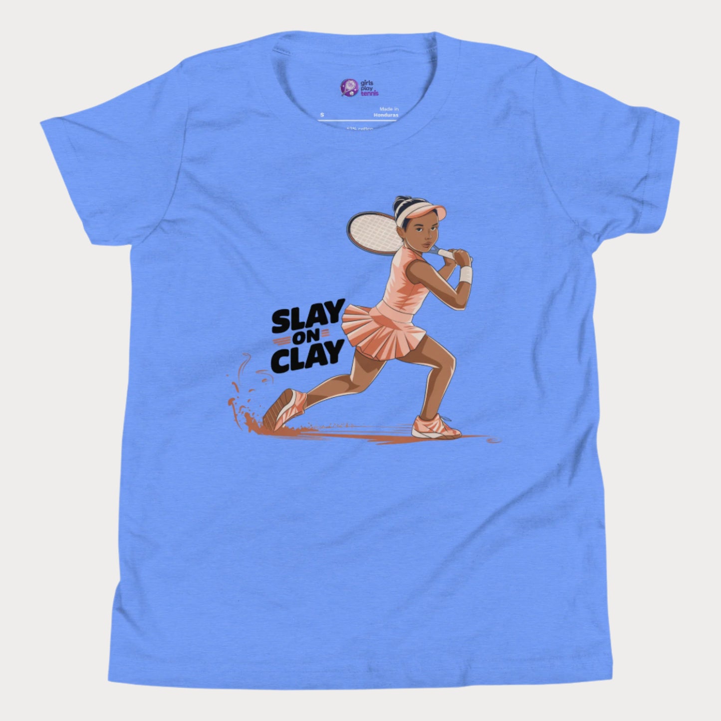 Blue tennis T-shirt featuring an illustrated young girl in a fierce backhand stance, sliding on a clay court with the phrase "Slay on Clay."