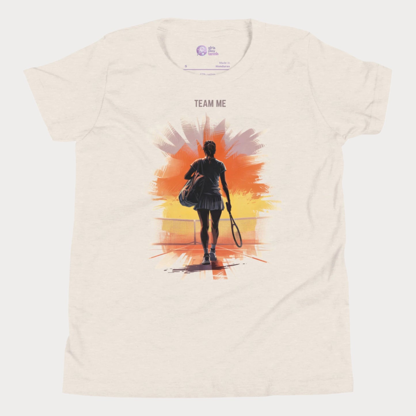 Beige girls tennis t-shirt with a silhouette of a young player walking onto a sunset-lit court and the slogan "TEAM ME" above.