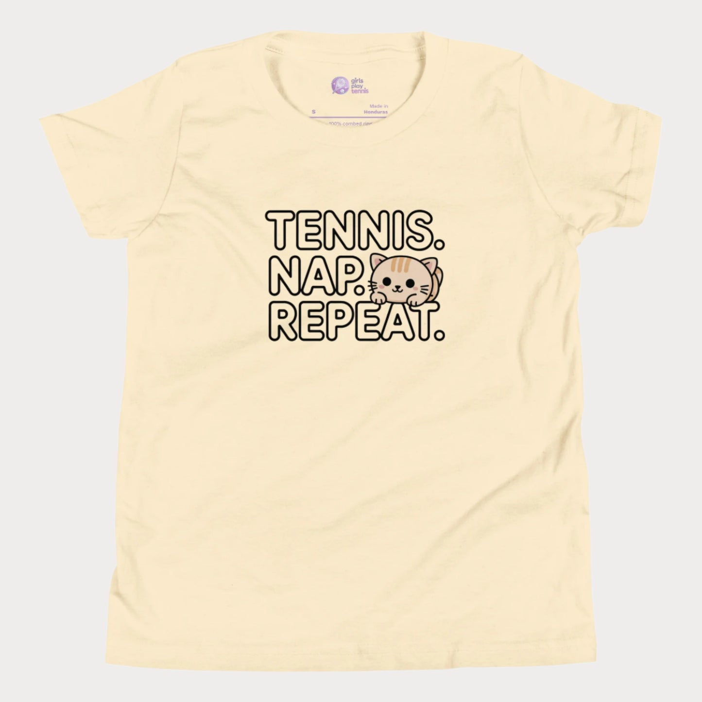 Cream kids tennis t-shirt with “Tennis. Nap. Repeat.” text and a cute cartoon cat illustration, part of the Girls Play Tennis apparel line.