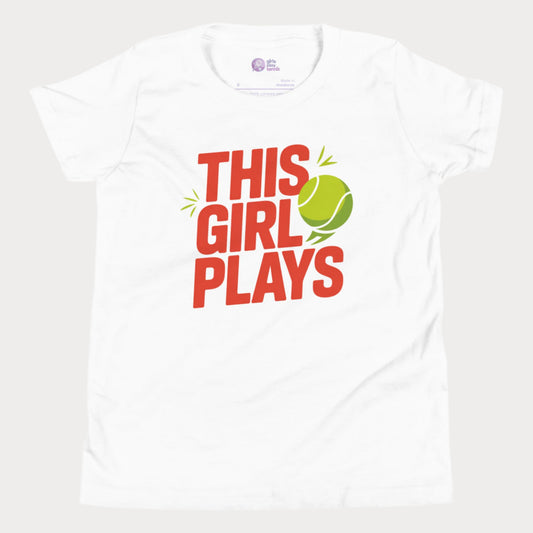 White girls' tennis t-shirt with bold “This Girl Plays” slogan and tennis ball graphic