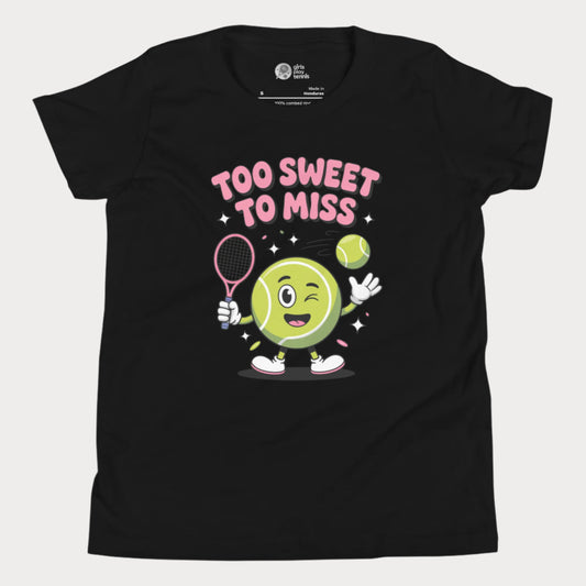 Black girls tennis t-shirt with a winking cartoon tennis ball holding a racket and the slogan “Too Sweet To Miss” in bold letters.