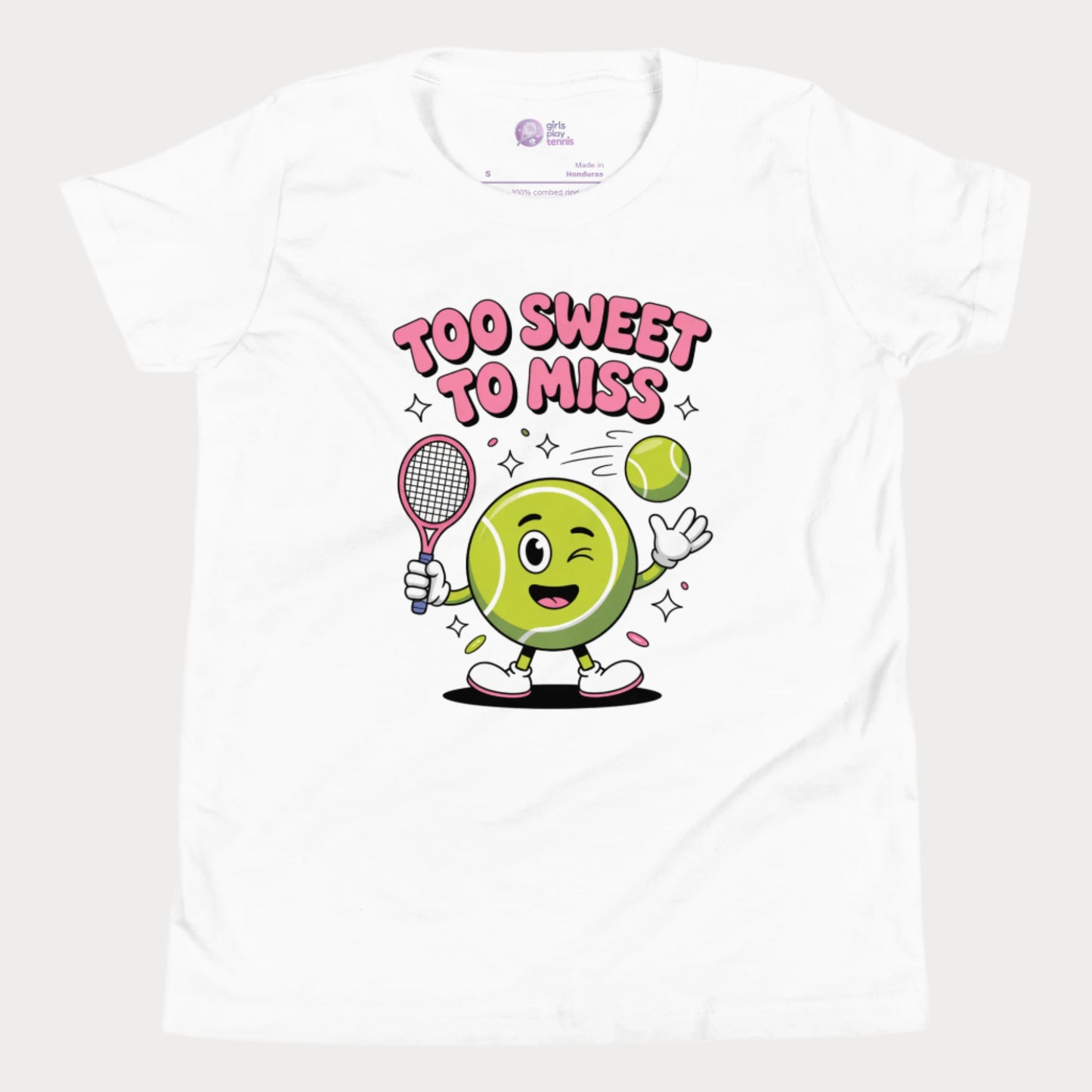 White girls tennis t-shirt with a winking cartoon tennis ball holding a racket and the slogan “Too Sweet To Miss” in bold letters.