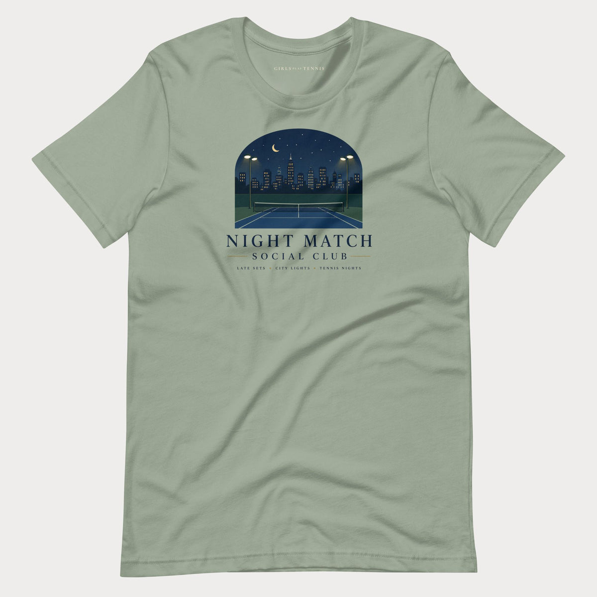 Sage green Night Match Social Club women's tennis T-shirt with an arched night skyline over a tennis court