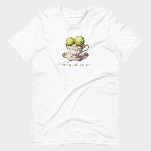 A white short-sleeve crewneck t-shirt featuring a vintage-style graphic of green tea spheres in a teacup on a saucer, with the text 'ACES AND AFTERNOON TEA' printed below.