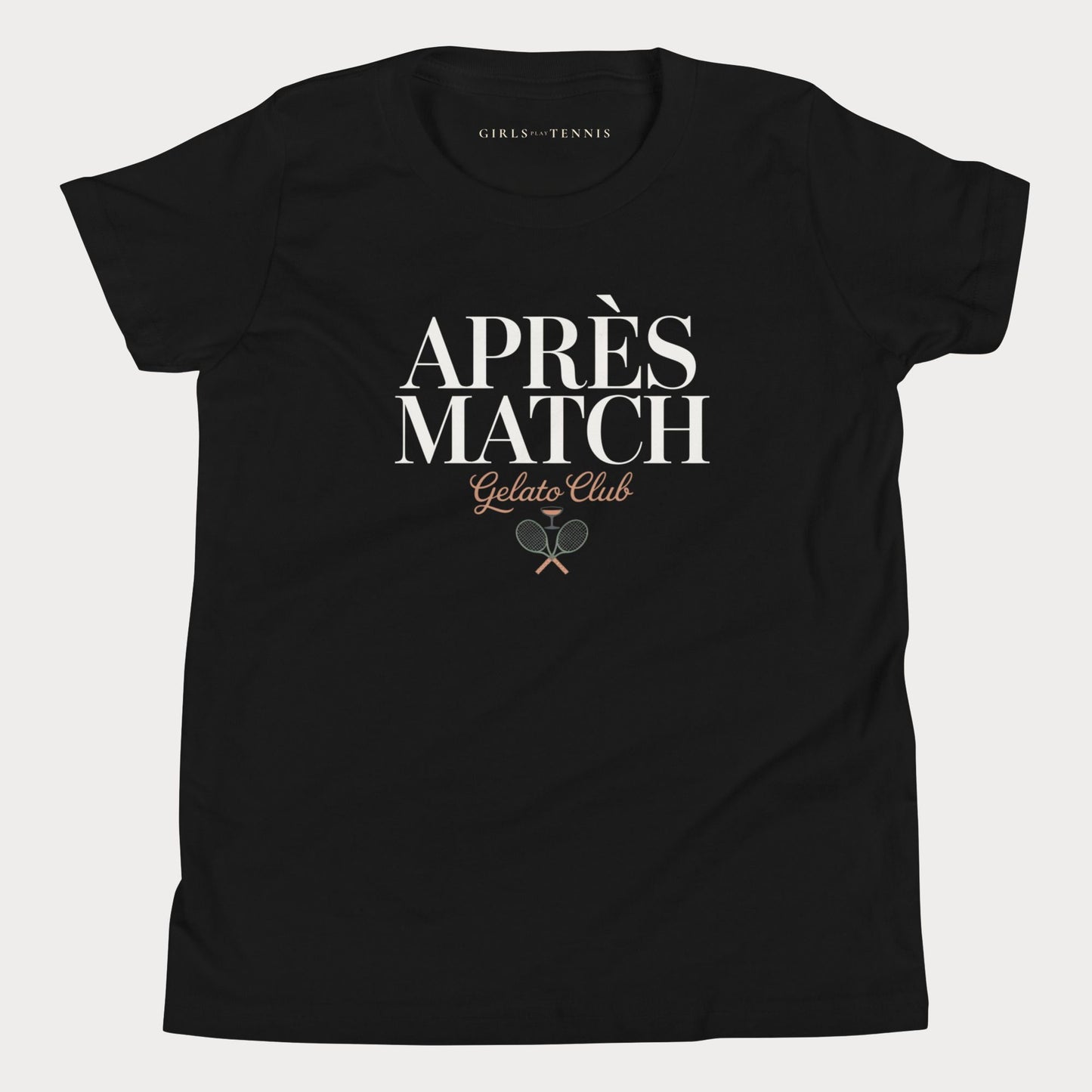 A black short-sleeve crewneck girls tennis t-shirt with a graphic print on the front reading 'APRÈS MATCH Gelato Club' in white and brown lettering, featuring crossed tennis rackets. The inner neck label shows 'GIRLS PLAY TENNIS'.
