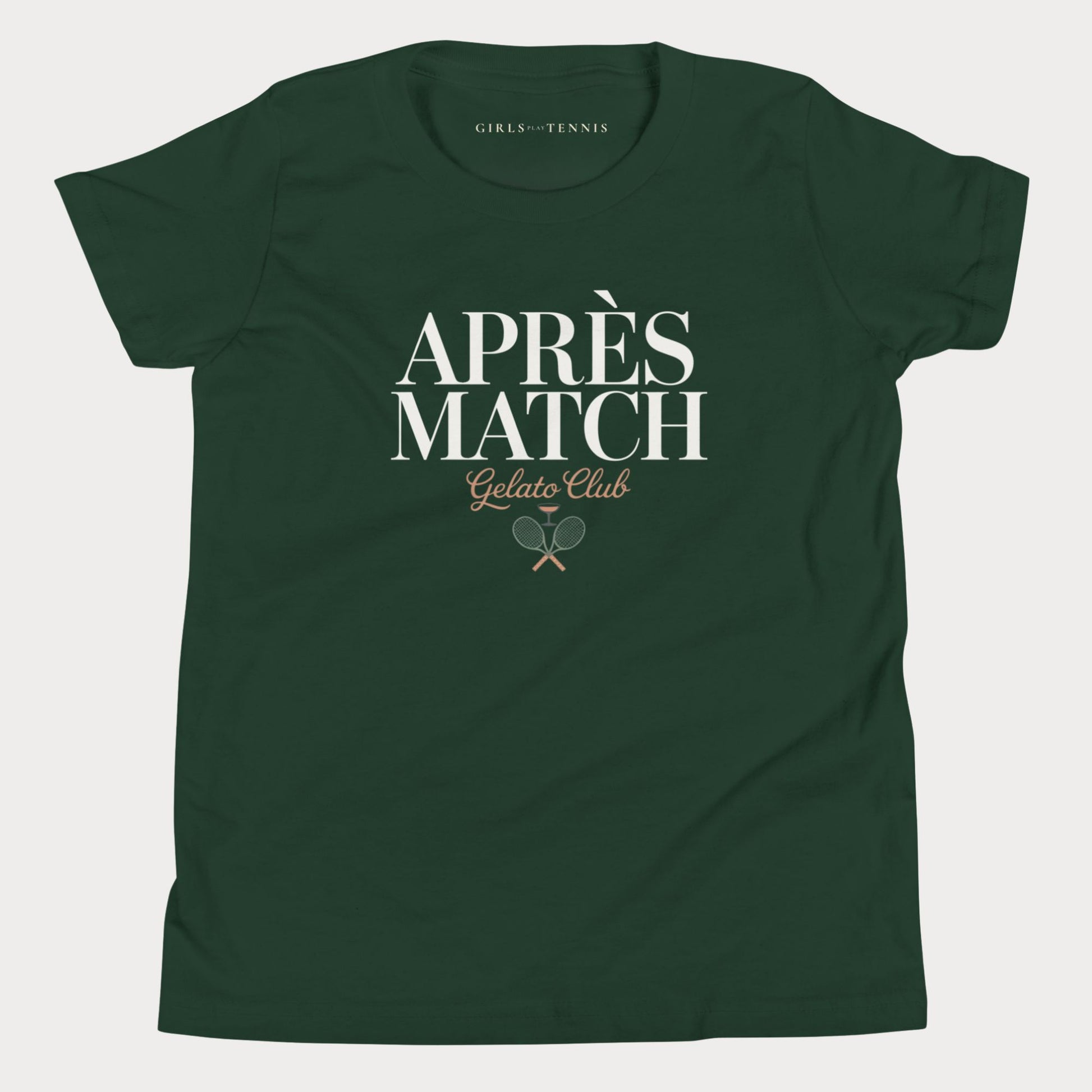 A dark green short-sleeve girls tennis t-shirt with a white and gold graphic on the front reading 'APRÈS MATCH Gelato Club' with crossed tennis rackets, shown on a light gray background.