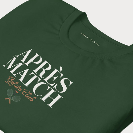 A close-up of a dark green t-shirt featuring a graphic print that reads 'APRÈS MATCH Gelato Club' with two crossed tennis rackets, on a light gray background.