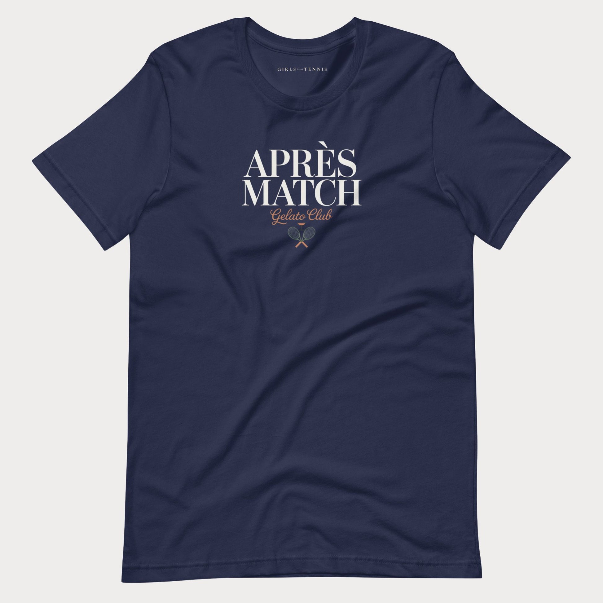 A navy blue short-sleeve women's tennis t-shirt with 'APRÈS MATCH Gelato Club' printed in white and gold on the chest, displayed flat against a light gray background.