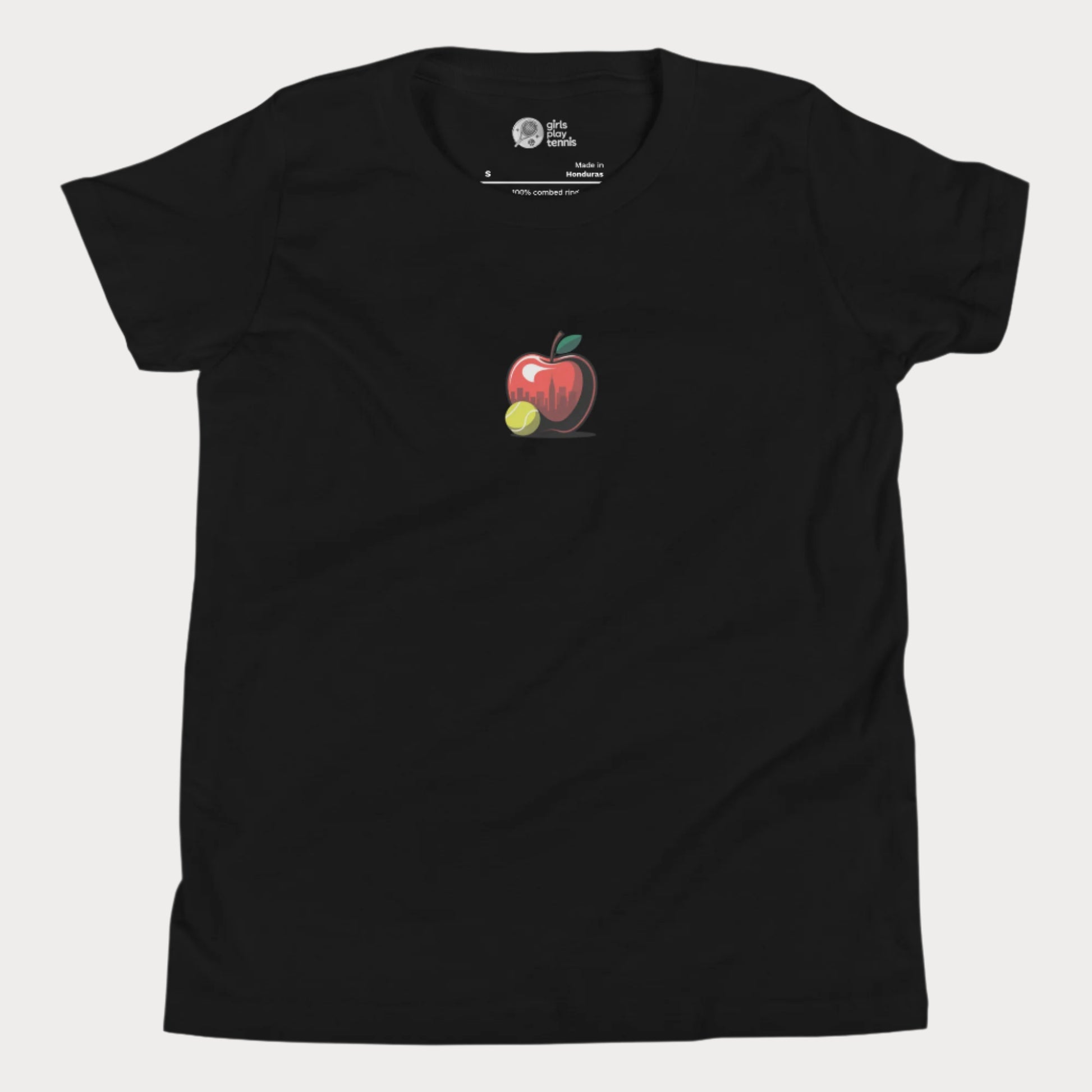 Big Apple tennis t-shirt for girls featuring apple with NYC skyline and tennis ball design.