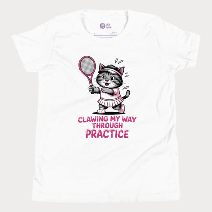 A white girls’ tennis t-shirt featuring a determined gray kitten in a pink tennis outfit holding a pink tennis racket. The kitten is sweating and focused, with the phrase “Clawing My Way Through Practice” in bold pink lettering underneath.