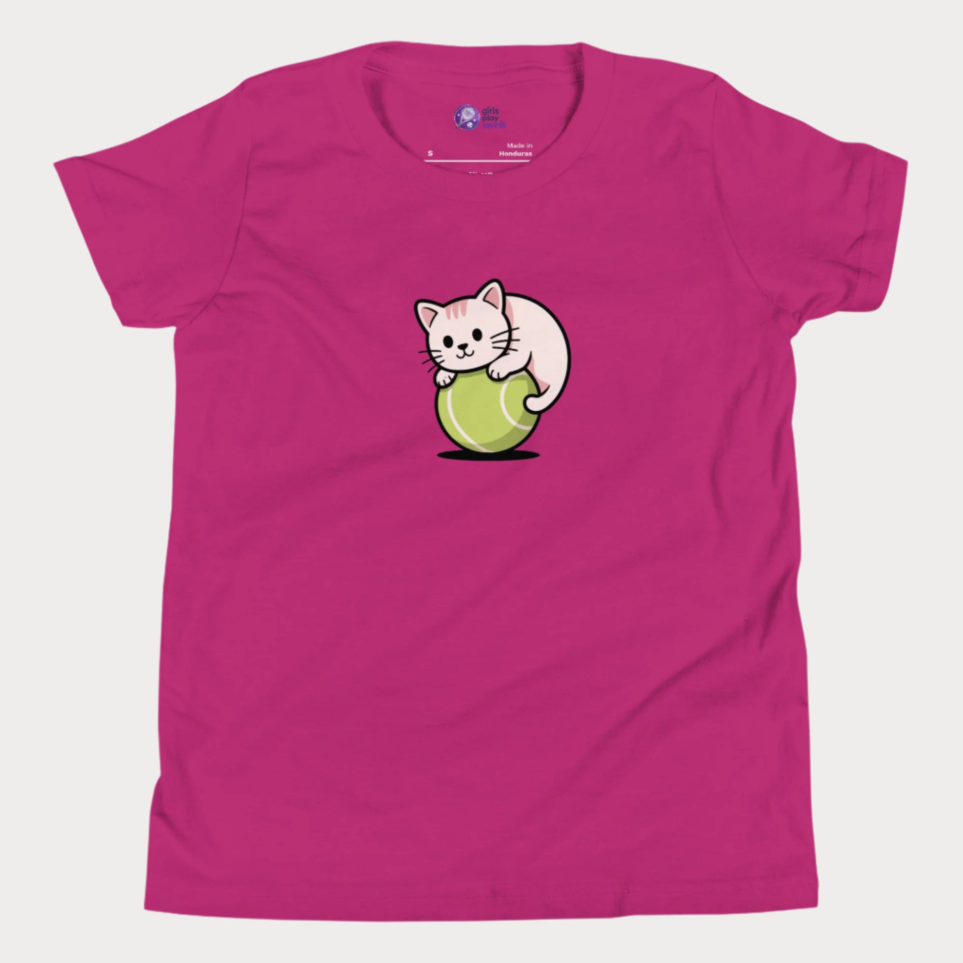 Bright pink girls’ tennis t-shirt featuring a cute kitten playfully curled around a bright green tennis ball in the center of the chest — a fun and whimsical design perfect for young tennis players who love animals and the game.