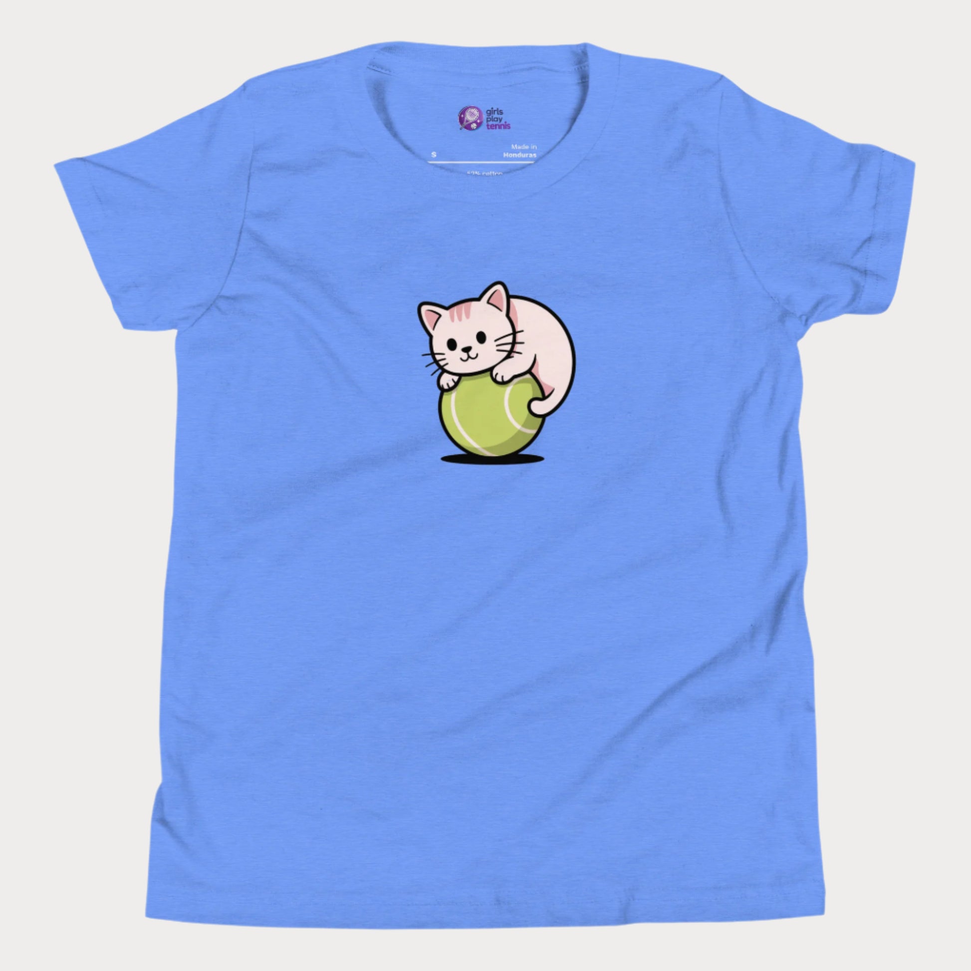 Heather blue girls’ tennis t-shirt featuring a cute kitten playfully curled around a bright green tennis ball in the center of the chest - a fun and whimsical design perfect for young tennis players who love animals and the game.