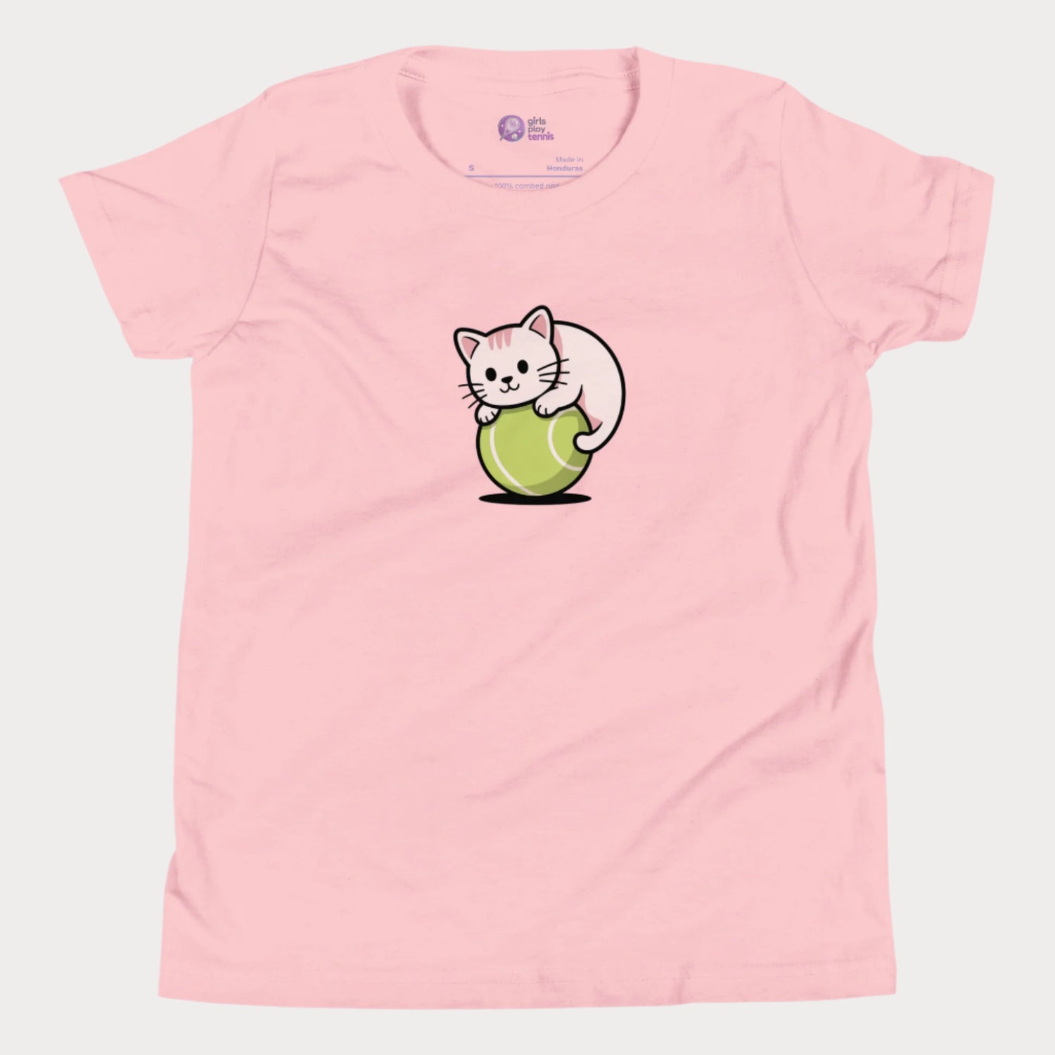 A light pink girls’ tennis t-shirt featuring a cute kitten playfully curled around a bright green tennis ball in the center of the chest — a fun and whimsical design perfect for young tennis players who love animals and the game.