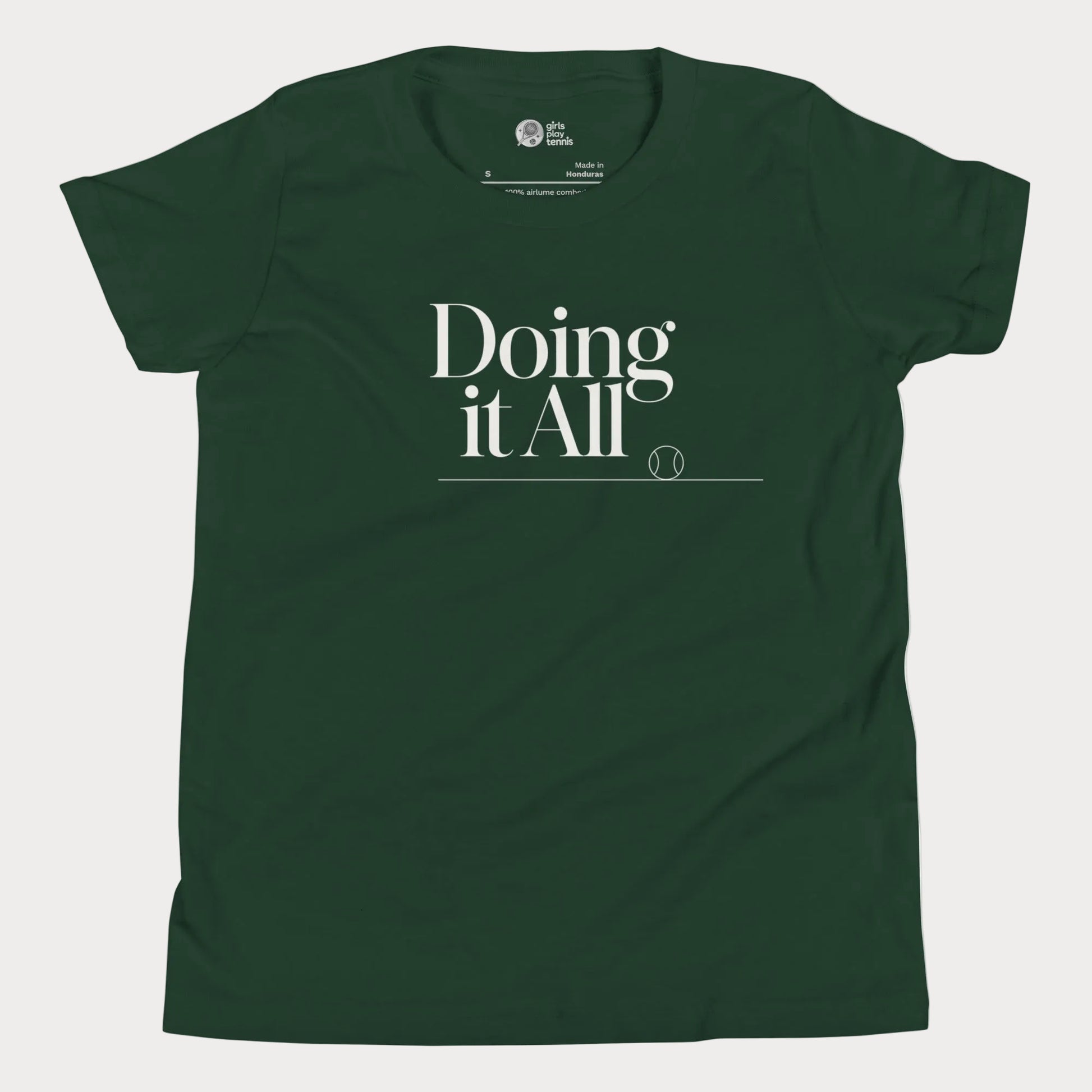 Doing It All tennis tee in forest green with minimalist white typography and tennis detail for women and girls