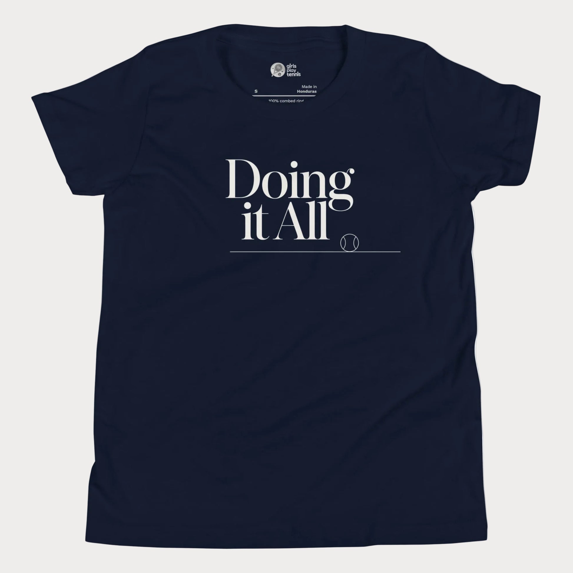 Doing It All tennis tee in navy with minimalist white typography and tennis detail for women and girls.