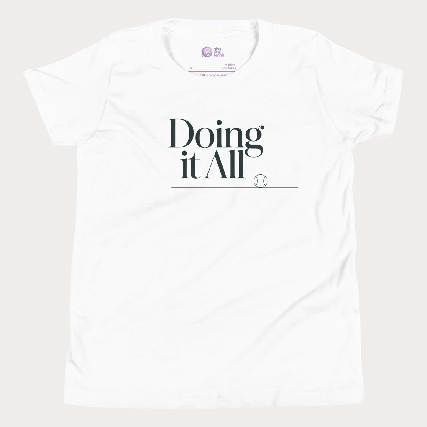 Doing It All tennis tee in white with minimalist white typography and tennis detail for women and girls