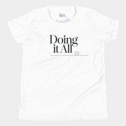 Doing It All tennis tee in white with minimalist white typography and tennis detail for women and girls