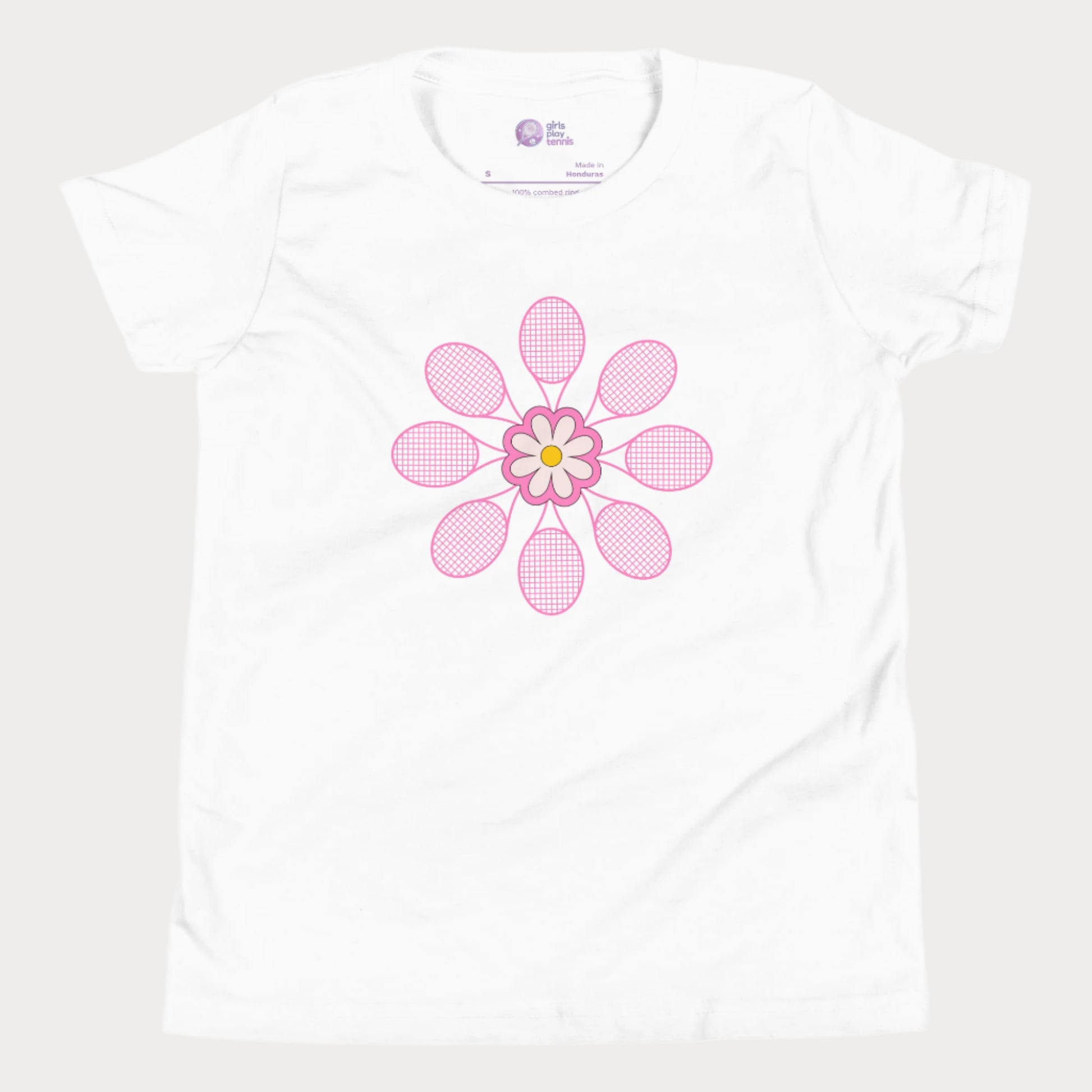 White girls tennis t-shirt with pink flower design made of tennis rackets in a mandala shape.