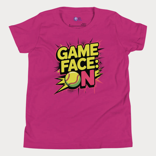 Berry kids tennis t-shirt with bold comic-style "Game Face: ON" graphic and tennis ball illustration.