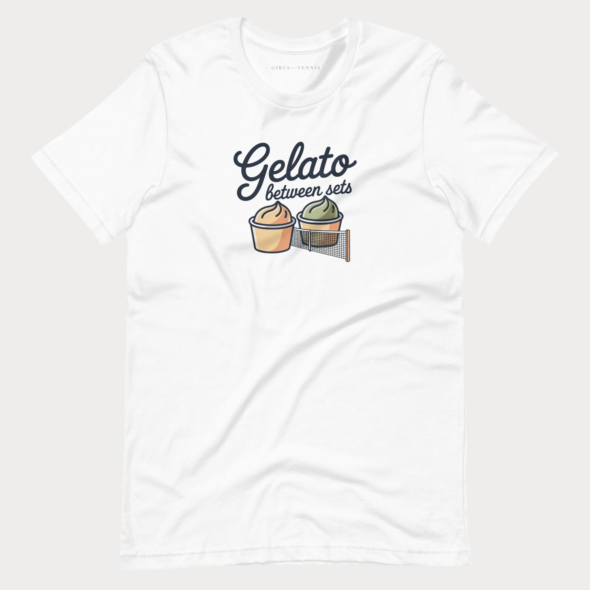A white short-sleeve crewneck women's tennis t-shirt featuring a graphic print of two gelato cups separated by a net, with the text 'Gelato between sets' written above them.