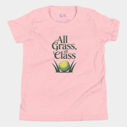 Pink girls’ tennis T-shirt with green text “All Grass, All Class” and tennis ball in grass graphic.
