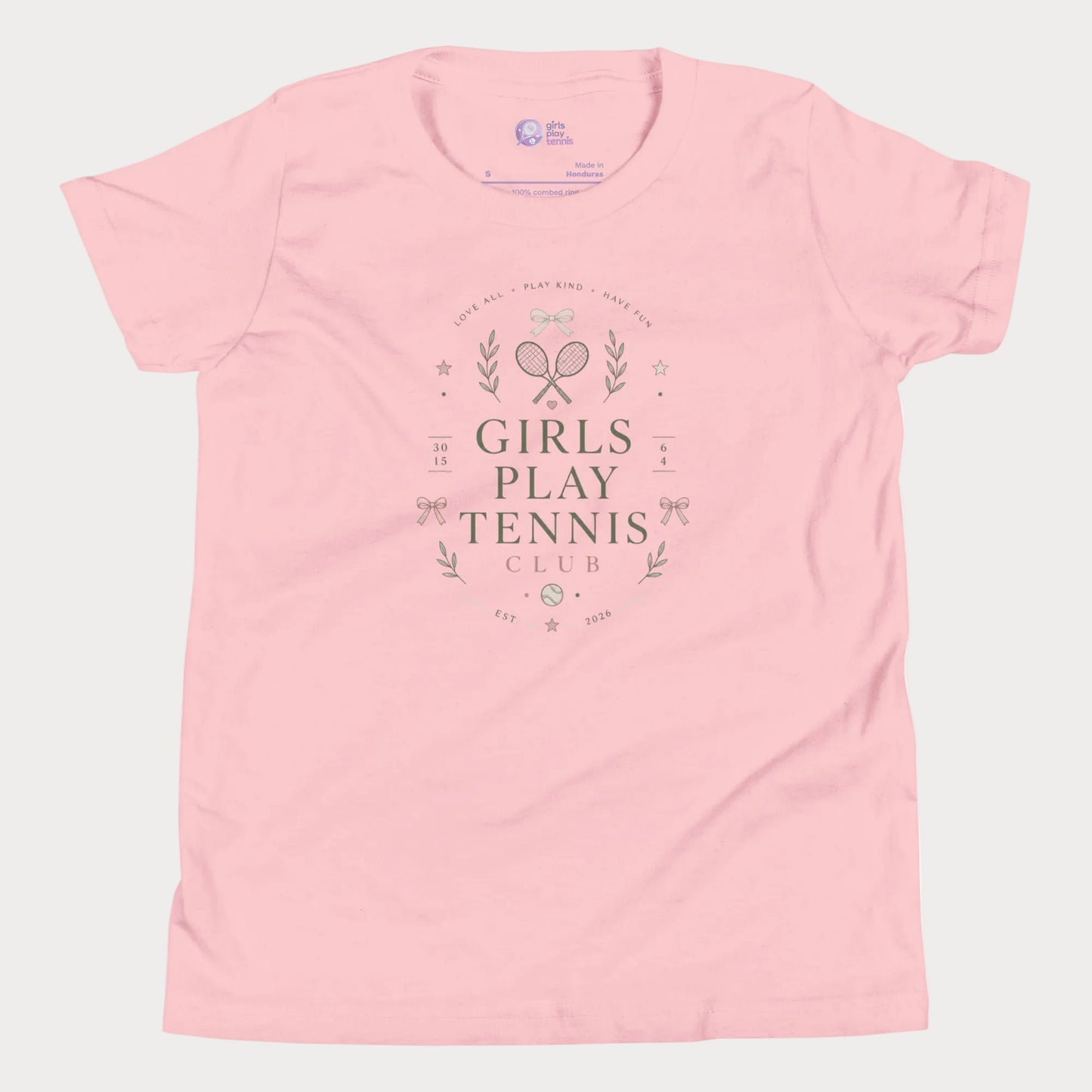 Soft pink girls tennis tee featuring minimalist tennis club graphics with bows and vintage-inspired details