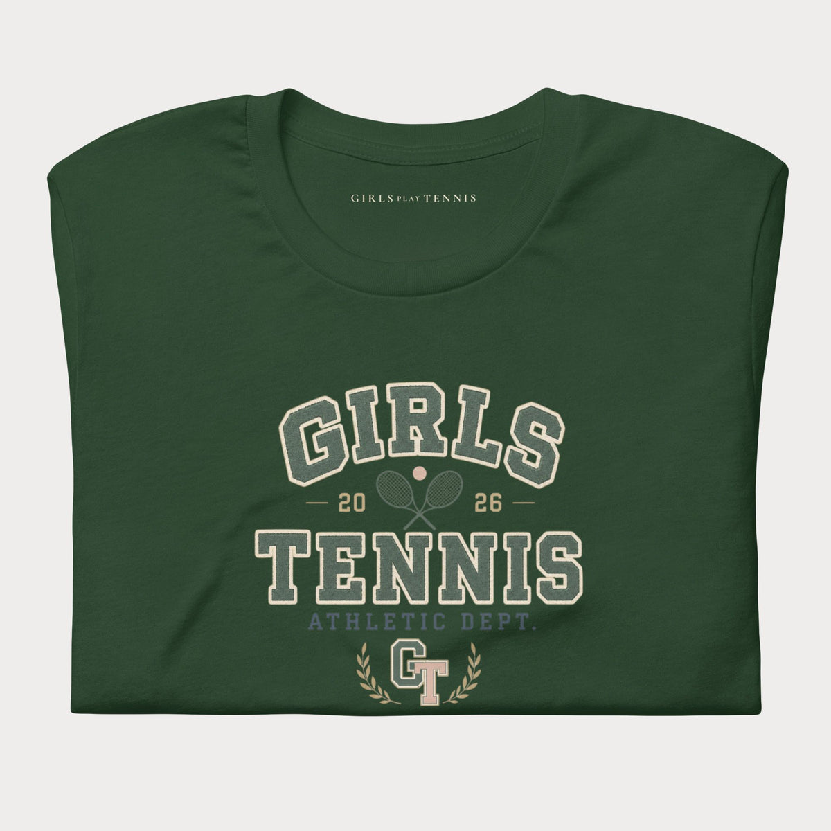 Folded forest green Girls Tennis Athletic Dept. women's tennis T-shirt with varsity lettering, crossed rackets and a GT laurel emblem