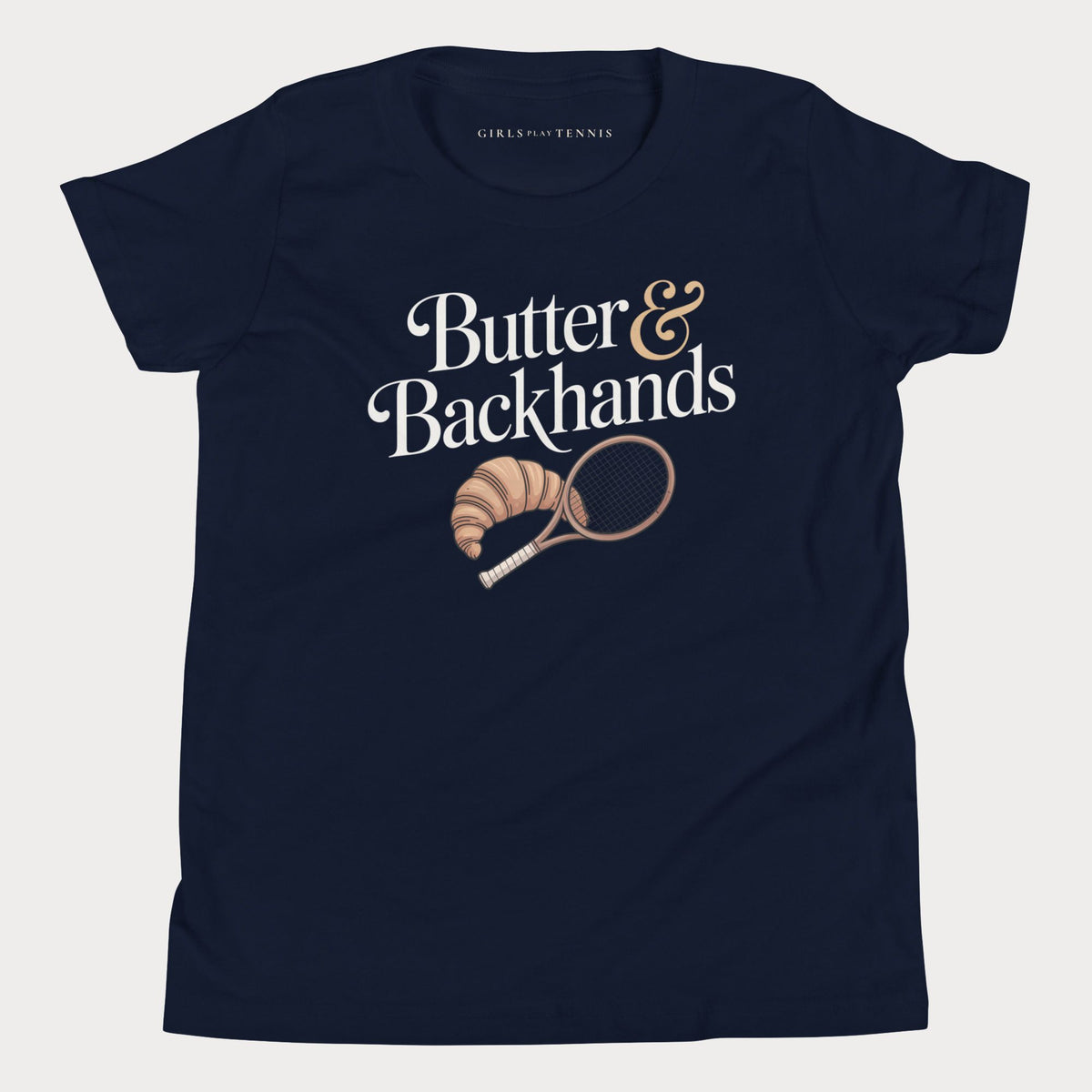 Navy Butter & Backhands girls' tennis T-shirt with a croissant and tennis racket graphic